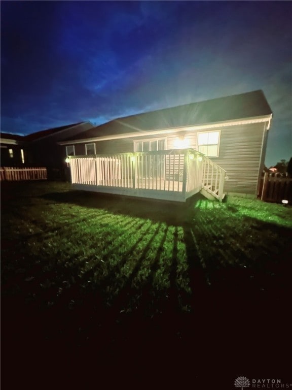 6655 Roycroft Dr, Middletown, OH 45042 - back of house at twilight with a wooden deck