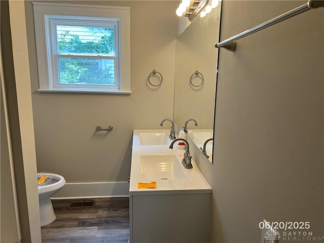 1410 Carlisle Ave, Dayton, OH 45420 - bathroom with wood finished floors and double vanity