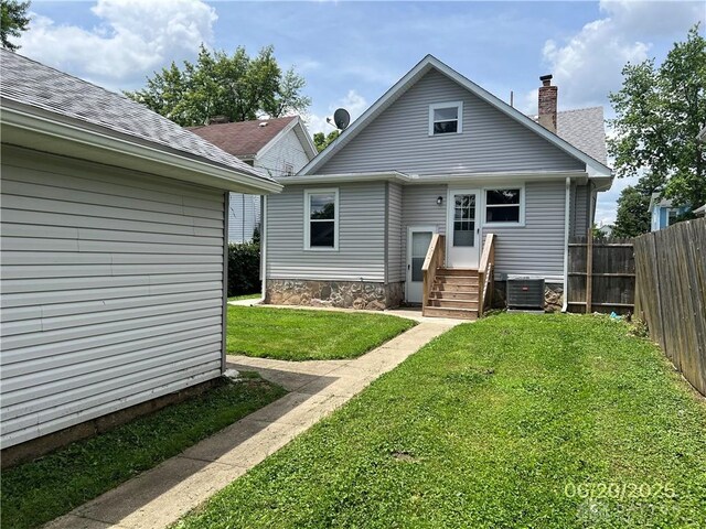 1410 Carlisle Ave, Dayton, OH 45420 - rear view of property featuring a chimney
