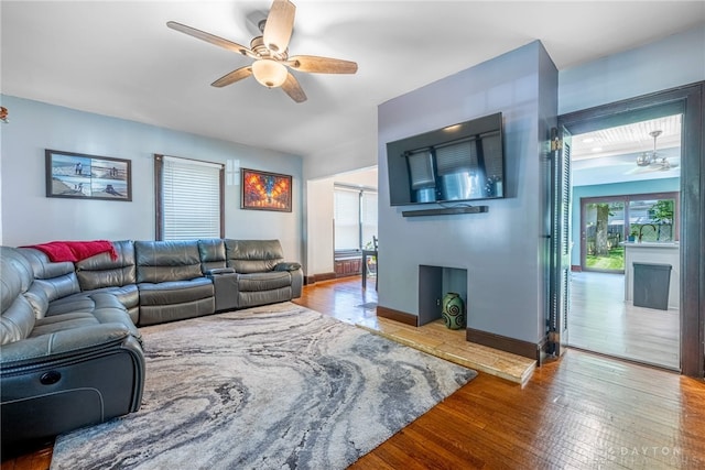 1525 Crescent Blvd, Kettering, OH 45409 - living room featuring a ceiling fan and wood finished floors