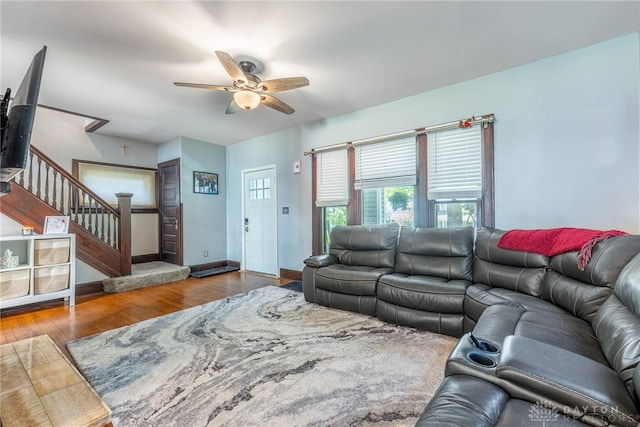 1525 Crescent Blvd, Kettering, OH 45409 - living room with ceiling fan, wood finished floors, and stairs