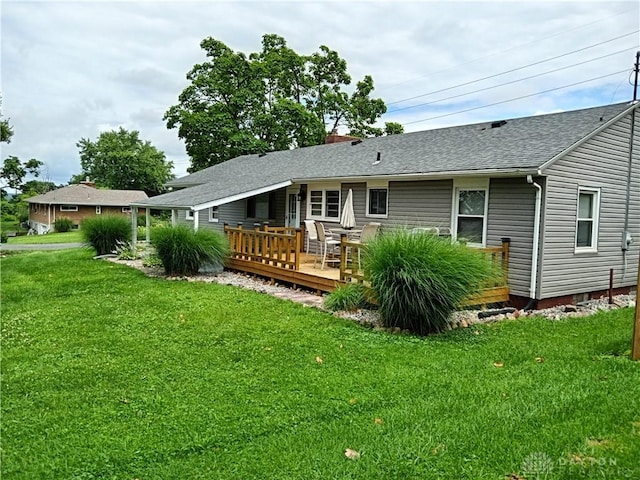 5757 S Dixie Hwy, Franklin, OH 45005 - rear view of house with a wooden deck, a lawn, roof with shingles, and a chimney