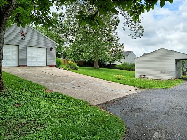 5757 S Dixie Hwy, Franklin, OH 45005 - view of green lawn featuring a garage and an outdoor structure