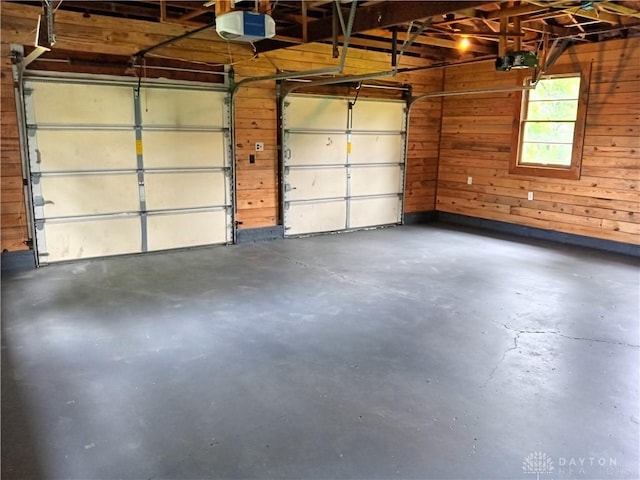 5757 S Dixie Hwy, Franklin, OH 45005 - garage featuring wooden walls and a garage door opener