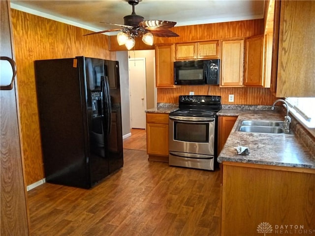 5757 S Dixie Hwy, Franklin, OH 45005 - kitchen featuring black appliances, dark wood finished floors, brown cabinets, and ceiling fan