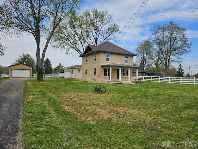 356 Old St Unit 122, Clearcreek Twp, OH 45036 - view of property exterior with covered porch, a detached garage, an outdoor structure, and stucco siding