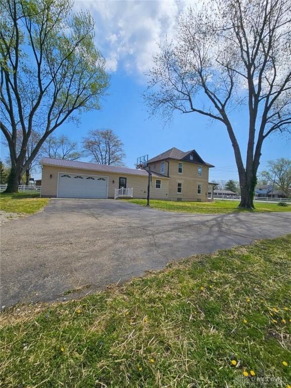 356 Old St Unit 122, Clearcreek Twp, OH 45036 - view of front of house with asphalt driveway and a garage