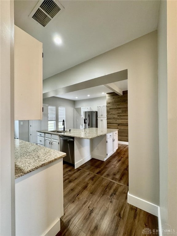 356 Old St Unit 122, Clearcreek Twp, OH 45036 - kitchen with stainless steel dishwasher, refrigerator with ice dispenser, white cabinetry, a large island with sink, and dark wood finished floors