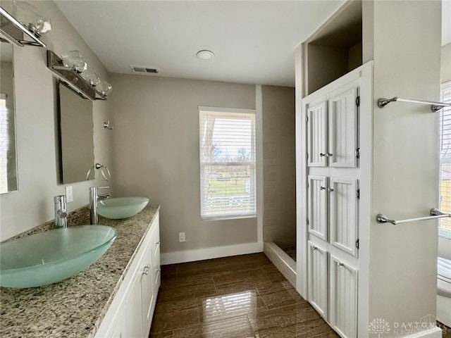 356 Old St Unit 122, Clearcreek Twp, OH 45036 - bathroom featuring double vanity and baseboards