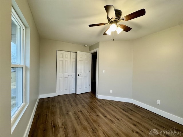 356 Old St Unit 122, Clearcreek Twp, OH 45036 - unfurnished bedroom featuring dark wood-type flooring, a closet, and ceiling fan
