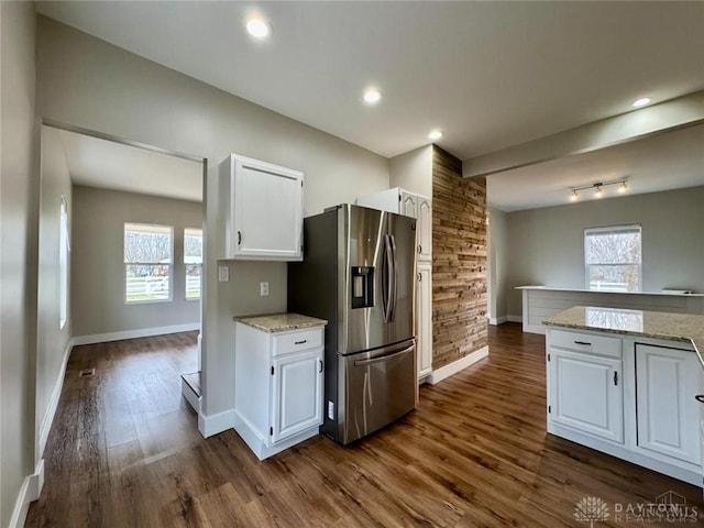 356 Old St Unit 122, Clearcreek Twp, OH 45036 - kitchen featuring stainless steel fridge, white cabinetry, dark wood-type flooring, and light stone counters