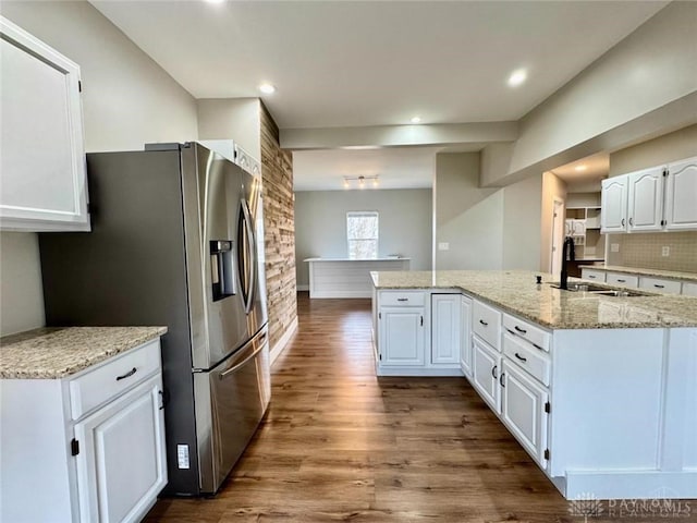356 Old St Unit 122, Clearcreek Twp, OH 45036 - kitchen featuring stainless steel fridge, white cabinets, dark wood-type flooring, backsplash, and recessed lighting