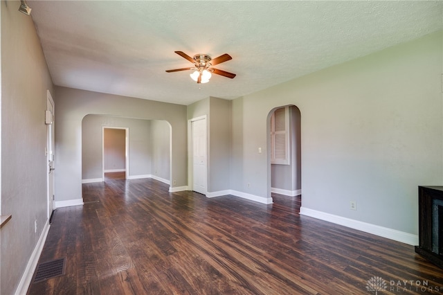 732 Central Ave, Franklin, OH 45005 - unfurnished room featuring arched walkways, a ceiling fan, and dark wood-type flooring