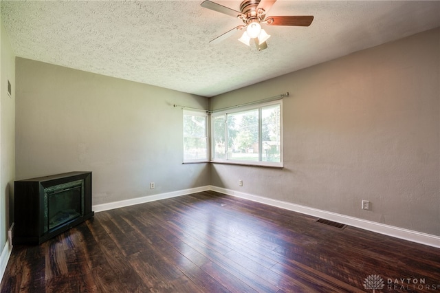 732 Central Ave, Franklin, OH 45005 - unfurnished room with a textured ceiling, dark wood-style flooring, and a ceiling fan