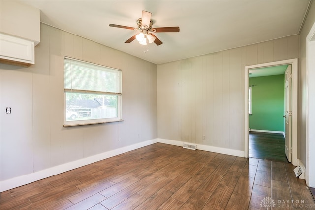 732 Central Ave, Franklin, OH 45005 - spare room with dark wood-style flooring and ceiling fan