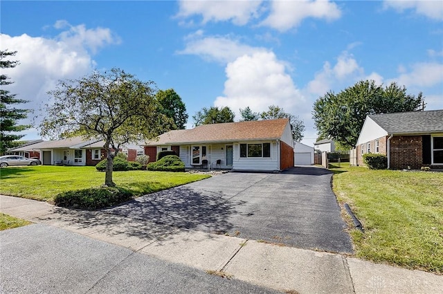106 Mark Ct, Germantown, OH 45327 - ranch-style home with a front yard, a garage, and an outdoor structure