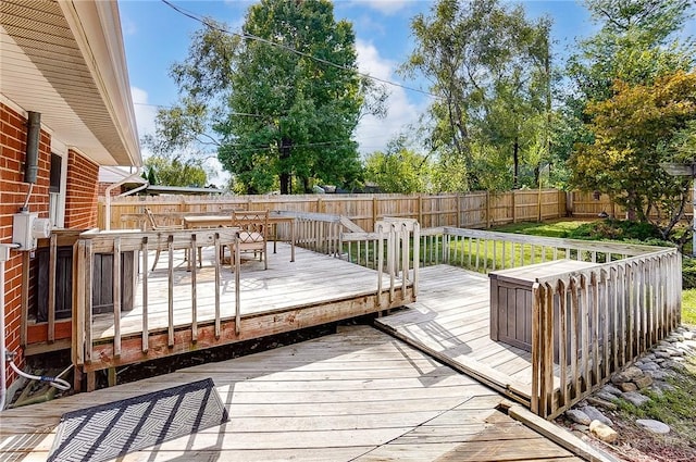 106 Mark Ct, Germantown, OH 45327 - wooden deck with a fenced backyard and outdoor dining area