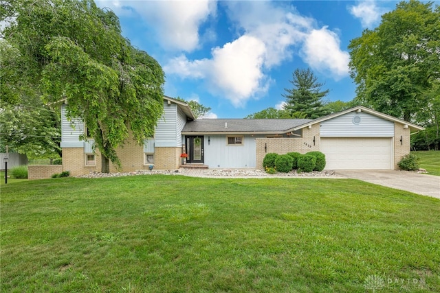 4629 Wicklow Dr, Middletown, OH 45042 - split level home featuring an attached garage, brick siding, concrete driveway, and a front yard