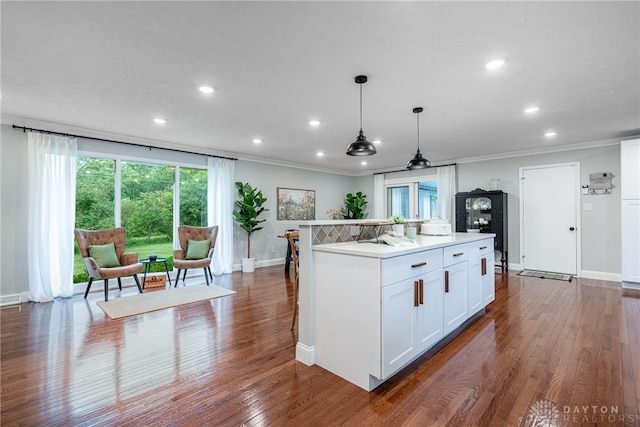 4629 Wicklow Dr, Middletown, OH 45042 - kitchen featuring white cabinetry, recessed lighting, a kitchen island, light countertops, and ornamental molding