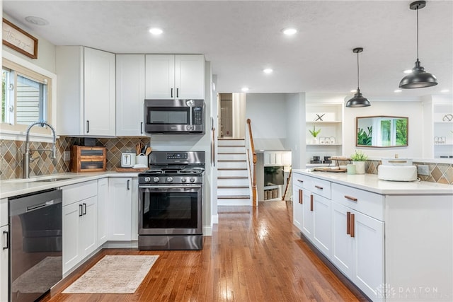 4629 Wicklow Dr, Middletown, OH 45042 - kitchen featuring stainless steel appliances, light countertops, white cabinets, and recessed lighting