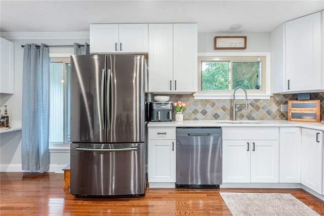 4629 Wicklow Dr, Middletown, OH 45042 - kitchen with appliances with stainless steel finishes, white cabinetry, light countertops, and decorative backsplash