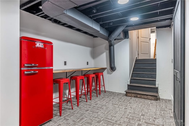 4629 Wicklow Dr, Middletown, OH 45042 - indoor dry bar featuring refrigerator, stairway, and carpet flooring