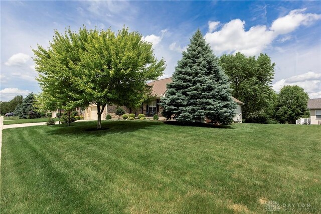 1210 Greystone Cir, Dayton, OH 45414 - view of grassy yard with an attached garage