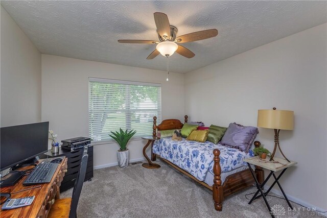 1210 Greystone Cir, Dayton, OH 45414 - carpeted bedroom with a textured ceiling and a ceiling fan