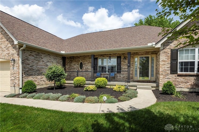1210 Greystone Cir, Dayton, OH 45414 - view of front facade featuring a porch, a shingled roof, brick siding, and an attached garage