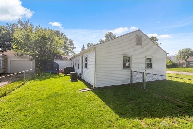 303 Erie Ave, Fairborn, OH 45324 - back of property with a fenced backyard and a detached garage