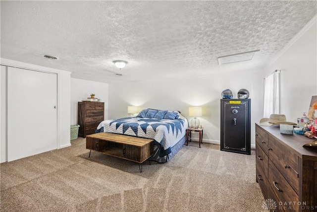 303 Erie Ave, Fairborn, OH 45324 - bedroom featuring light carpet, a textured ceiling, and attic access