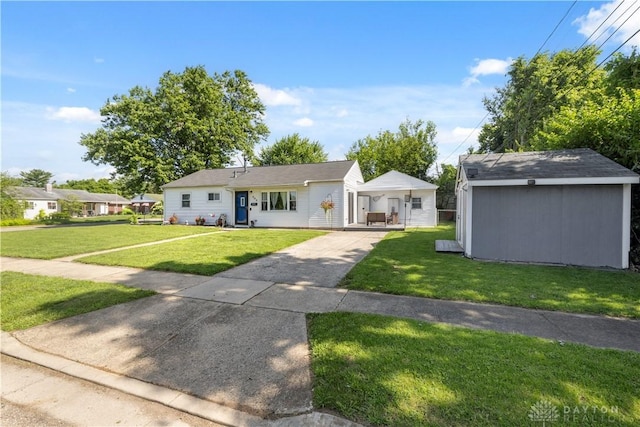 303 Erie Ave, Fairborn, OH 45324 - view of front of home featuring a front yard, driveway, and a shed