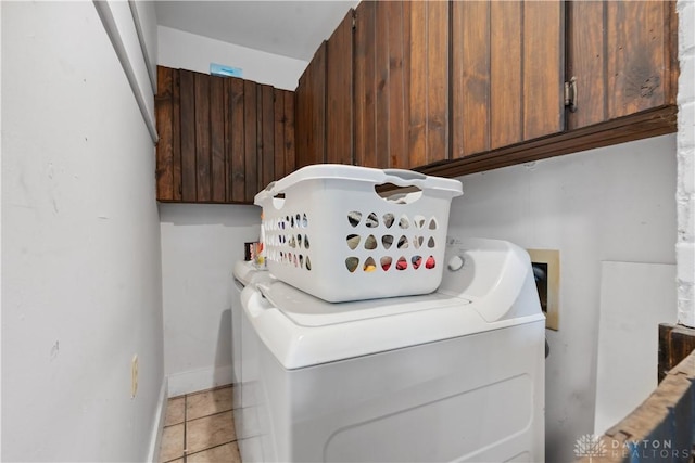 8760 State Route 380, Chester Twp, OH 45177 - laundry room with cabinet space, light tile patterned floors, and separate washer and dryer