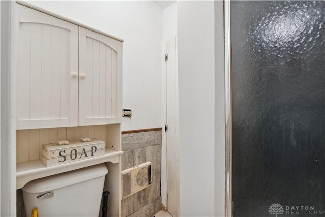 8760 State Route 380, Chester Twp, OH 45177 - bathroom featuring toilet and a wainscoted wall