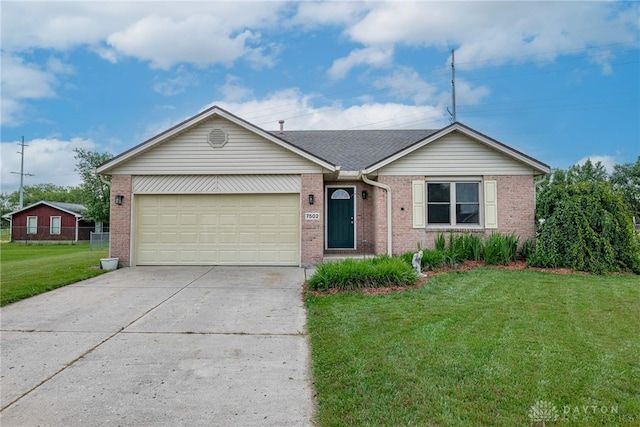 7502 Ned Ct, Franklin, OH 45005 - ranch-style house with concrete driveway, a front yard, an attached garage, and brick siding