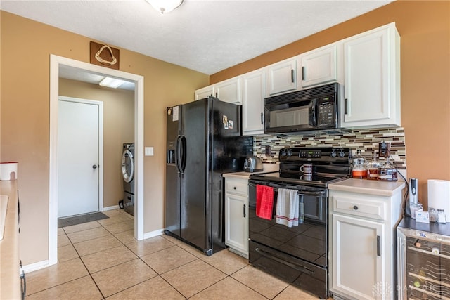7502 Ned Ct, Franklin, OH 45005 - kitchen featuring black appliances, beverage cooler, white cabinets, tasteful backsplash, and light tile patterned floors