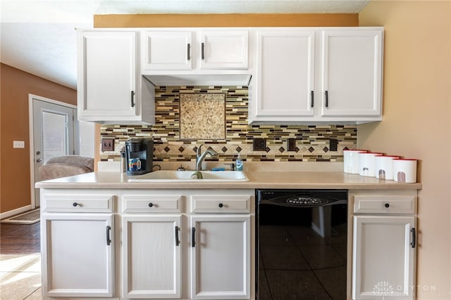 7502 Ned Ct, Franklin, OH 45005 - kitchen with black dishwasher, white cabinetry, and light countertops
