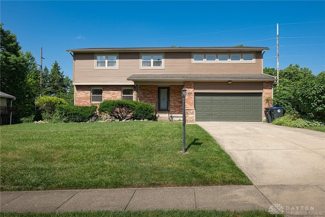 6171 Marshall Rd, Dayton, OH 45459 - view of front of property with brick siding, an attached garage, driveway, and a front yard