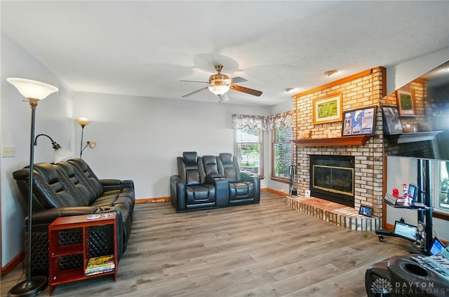 3244 N Shoemaker Rd, Lebanon, OH 45036 - living room featuring ceiling fan, wood finished floors, and a fireplace