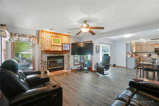 3244 N Shoemaker Rd, Lebanon, OH 45036 - living room with light wood-style flooring, a ceiling fan, and a fireplace