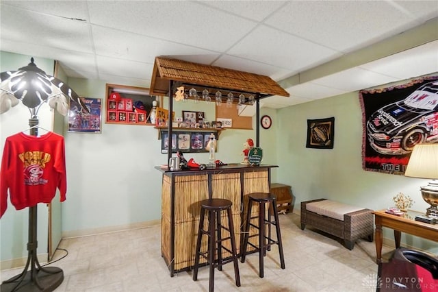 3244 N Shoemaker Rd, Lebanon, OH 45036 - indoor dry bar with a paneled ceiling and tile patterned floors