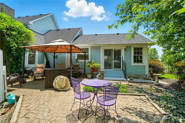 3244 N Shoemaker Rd, Lebanon, OH 45036 - rear view of house featuring entry steps, a shingled roof, a gazebo, and a patio