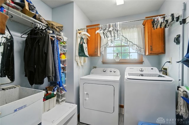 3244 N Shoemaker Rd, Lebanon, OH 45036 - laundry room featuring washing machine and clothes dryer and cabinet space