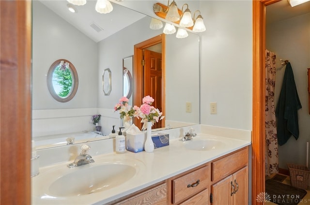 3244 N Shoemaker Rd, Lebanon, OH 45036 - bathroom with double vanity, lofted ceiling, and a chandelier