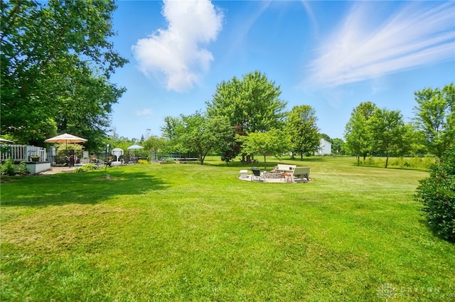 3244 N Shoemaker Rd, Lebanon, OH 45036 - view of yard featuring a fire pit and a patio area