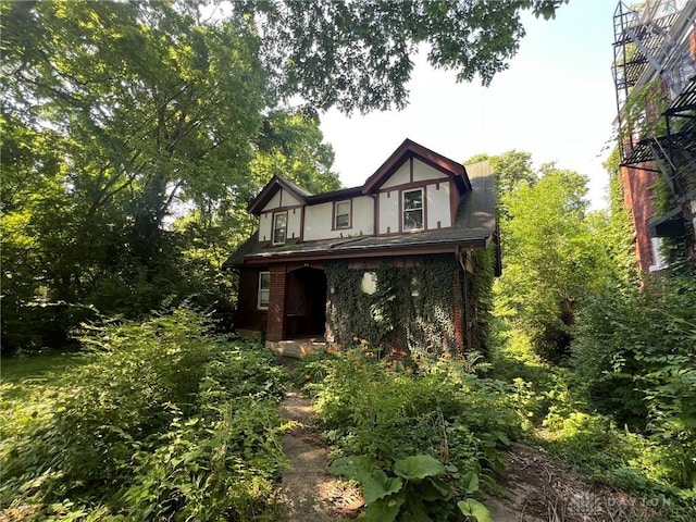 813 S Fred Shuttlesworth Cir, Cincinnati, OH 45229 - back of house with covered porch and stucco siding