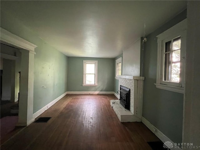 813 S Fred Shuttlesworth Cir, Cincinnati, OH 45229 - unfurnished living room featuring wood finished floors and a fireplace