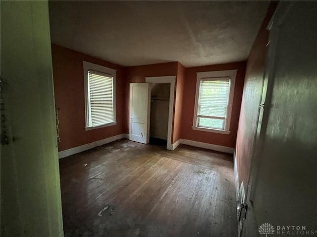813 S Fred Shuttlesworth Cir, Cincinnati, OH 45229 - unfurnished bedroom featuring baseboards and hardwood / wood-style flooring