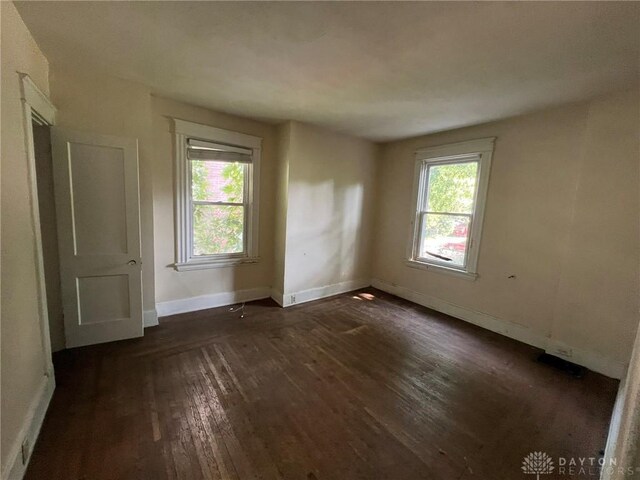 813 S Fred Shuttlesworth Cir, Cincinnati, OH 45229 - empty room featuring dark wood-type flooring and baseboards