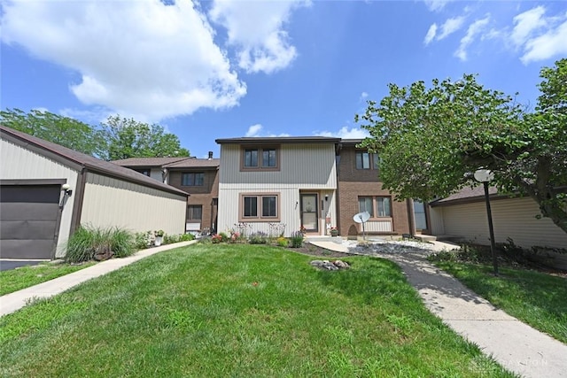 6004 Cinnamon Tree Ct, Englewood, OH 45322 - view of front of property featuring a front lawn and an attached garage